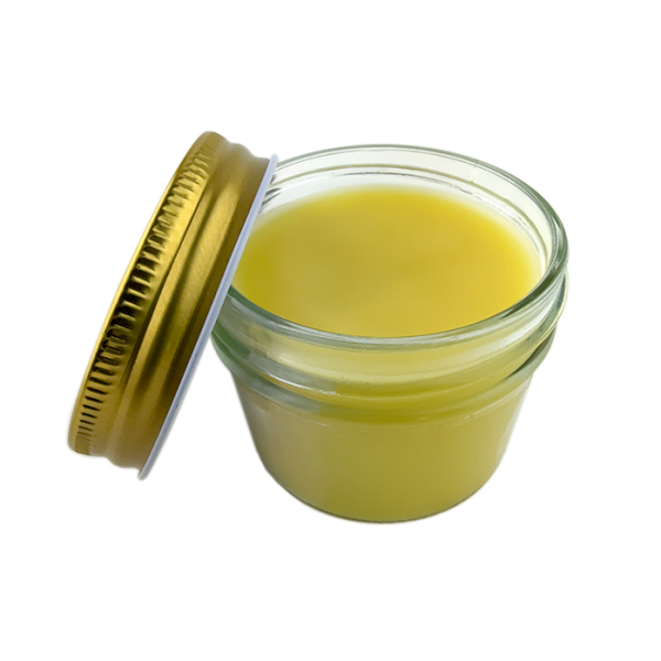 Natural beeswax cream jar photographed at a 45 degree angle